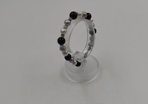 χειροποίητο βραχιόλι από ατσάλι με μαργαριτάρι,όνυχα και αιματίτη